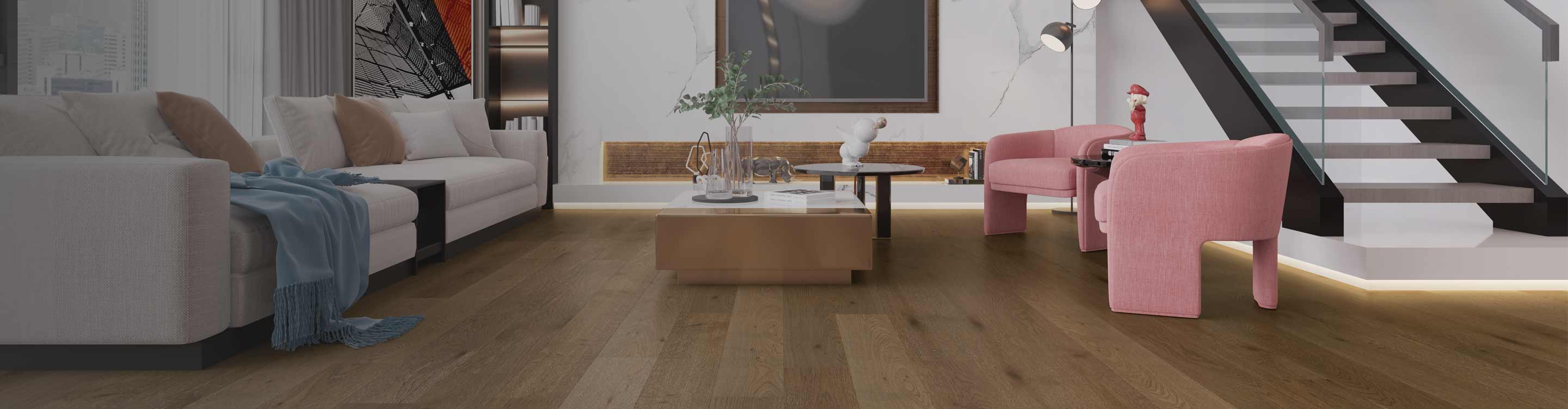 Hardwood flooring in a living room with velvet accent chairs